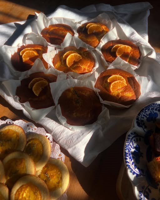 Small orange cakes cooling on a cloth